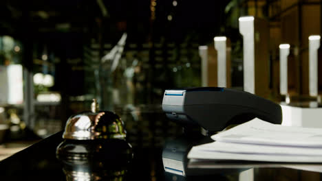 Side-view-of-guest-hands-holding-credit-card