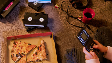 VHS-cassettes-and-pizza-on-the-floor