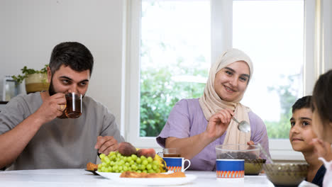 Close-up-view-of-islamic-family-having-breakfast.