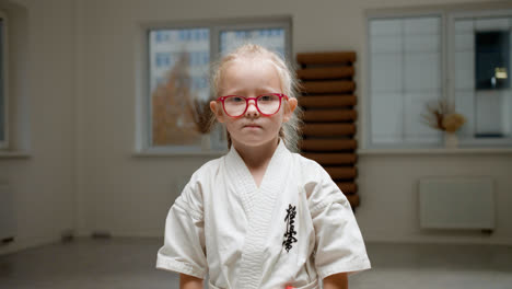 Girl-in-white-kimono-in-martial-arts-class