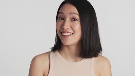 Asian-woman-smiling-on-camera.