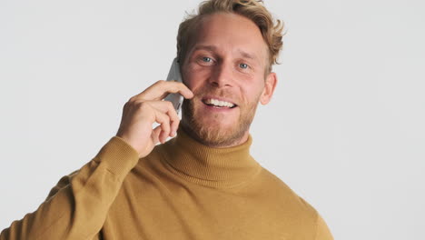 Happy-guy-having-a-conversation-on-phone
