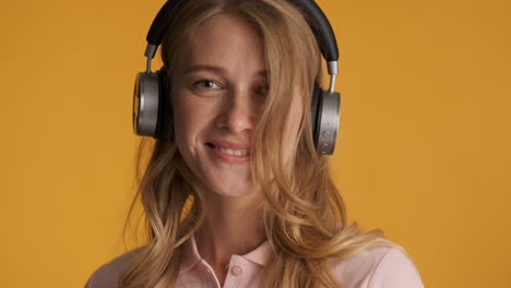 Caucasian-woman-in-headphones-listening-to-music.