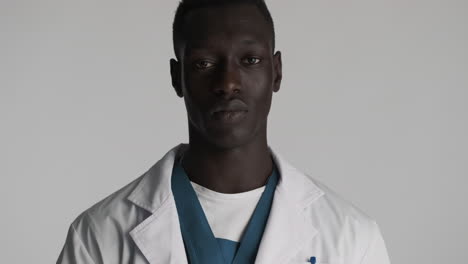 African-american-doctor-on-grey-background.