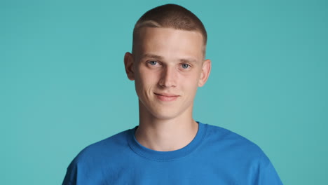 Smiling-man-wearing-blue-T-Shirt