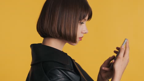 Side-view-of-young-woman-using-smartphone