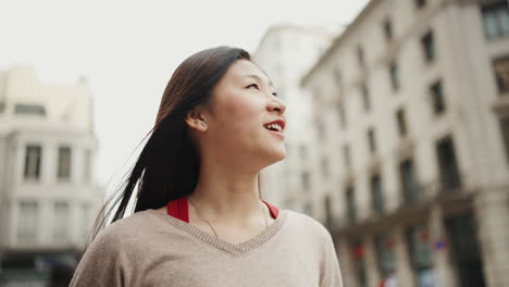 Asian-girl-walking-and-exploring-new-city.