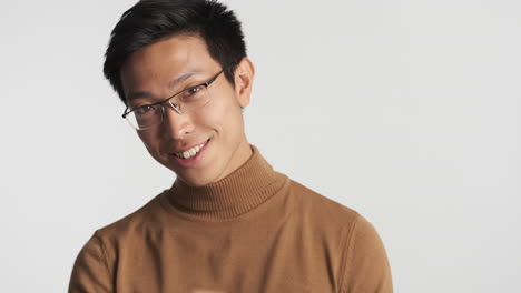 Asian-man-in-eyeglasses-looking-at-the-camera.
