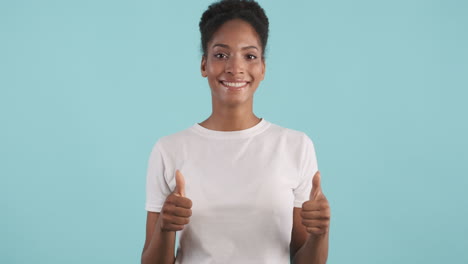 Smiling-woman-giving-thumbs-up