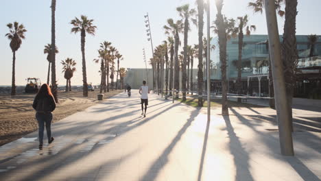 Conceptual-shot-of-young-sporty-man-running-in-the-morning-along-seaside