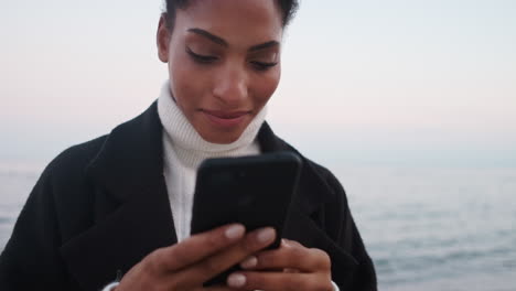 African-American-girl-using-mobile-phone.