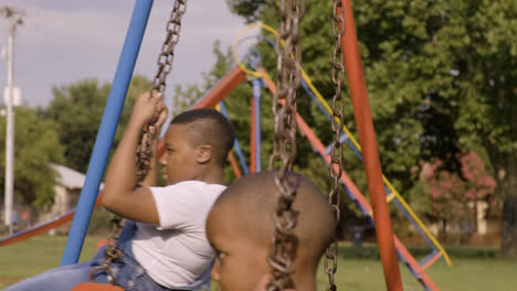 Children-playing-on-the-swings