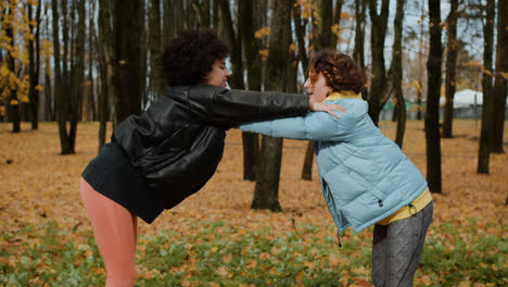 Two-women-stretching-outdoors