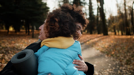 Two-friends-saying-goodbye-outdoors