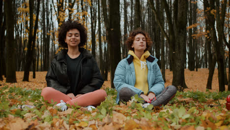 Two-women-meditating-outdoors