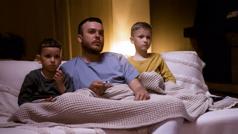 Father-and-sons-watching-film