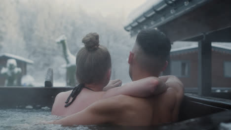 Couple-hugging-inside-a-hot-tub