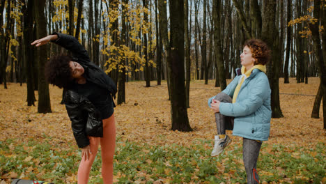 Two-women-stretching-outdoors