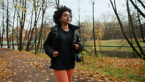 Young-woman-running-at-the-park