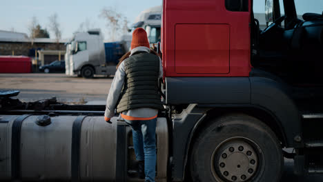 Woman-checking-the-wires-of-the-truck