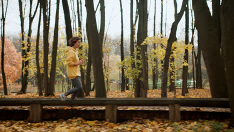 Side-view-of-woman-jogging-outdoors