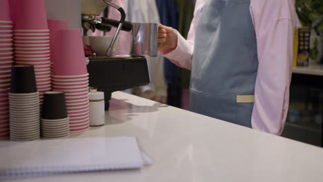 Female-barista-preparing-coffee