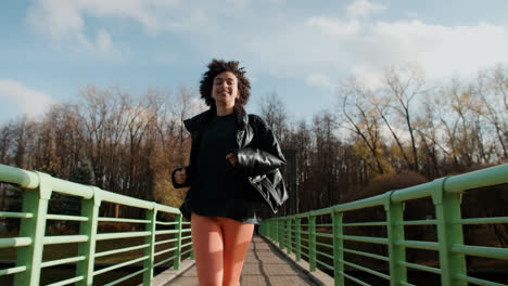 Girl-running-on-a-bridge