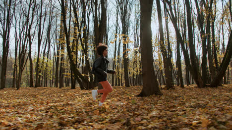 Side-view-of-woman-jogging-outdoors