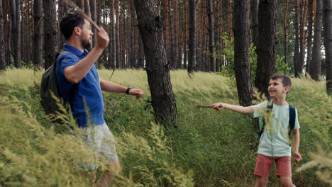 Man-and-child-playing-in-the-forest