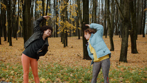 Two-women-stretching-outdoors