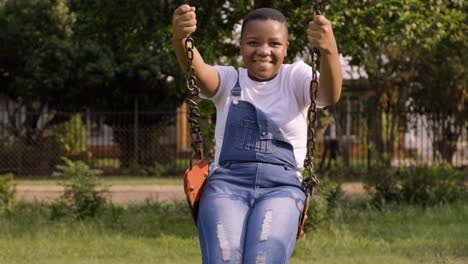 Child--playing-on-the-swings