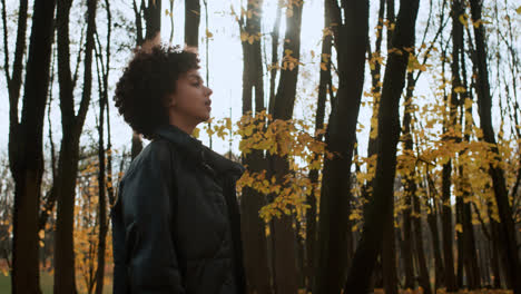 Side-view-of-woman-walking-at-the-park