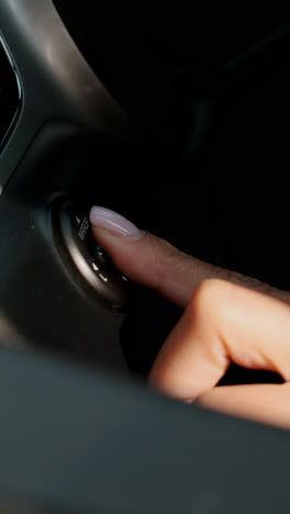 Woman-adjusting-rear-mirror