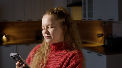 Happy-woman-with-phone-at-home