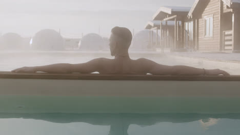 Man-resting-at-the-pool