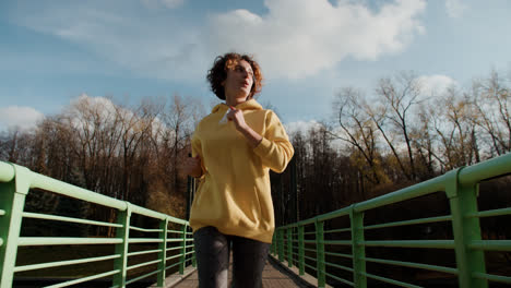 Girl-running-on-a-bridge