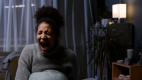 Young-woman-shouting-at-home