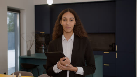 Real-estate-agent-posing-indoors