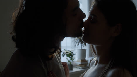 Couple-kissing-at-home