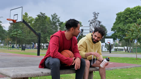 Men-talking-on-a-bench