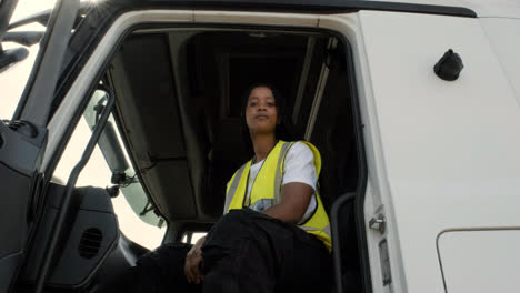 Driver-sitting-on-her-truck