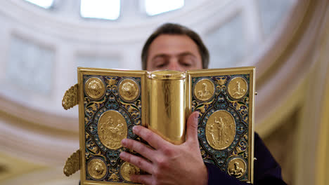 Priest-holding-holy-book