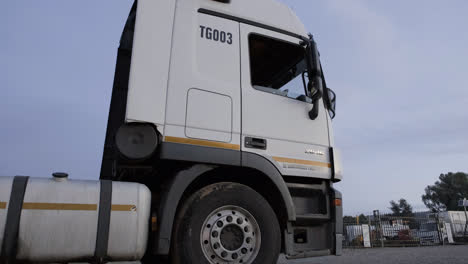 Young-woman-going-out-of-the-truck