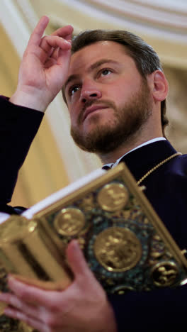 Priest-holding-holy-book