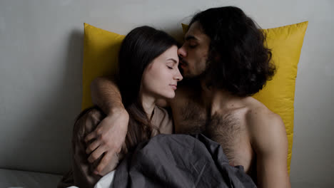Young-man-and-woman-in-bed