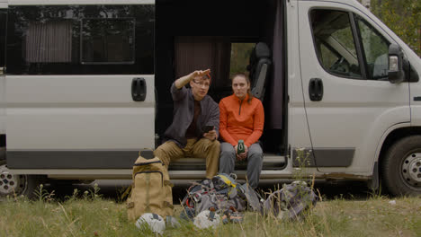 Heterosexual-couple-sitting-in-a-van