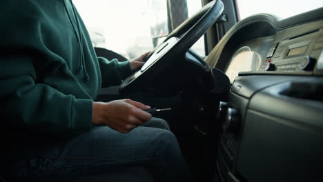 Young-woman-starting-the-truck