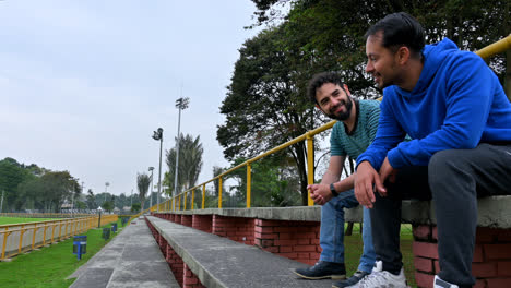 Men-sitting-on-grandstands