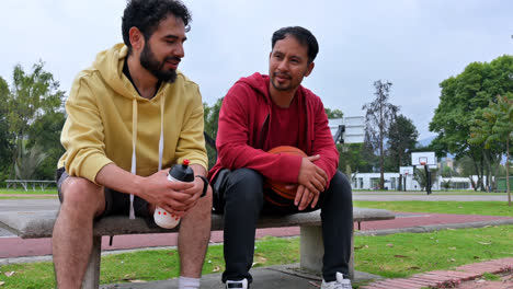 Men-talking-on-a-bench