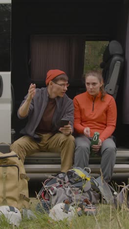 Heterosexual-couple-sitting-in-a-van